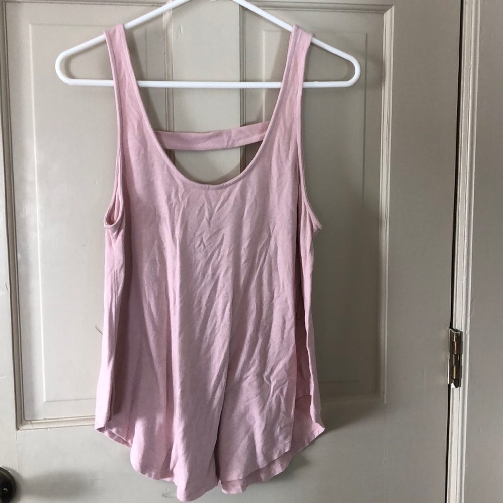 Pink loose fitting tank top with low cut back